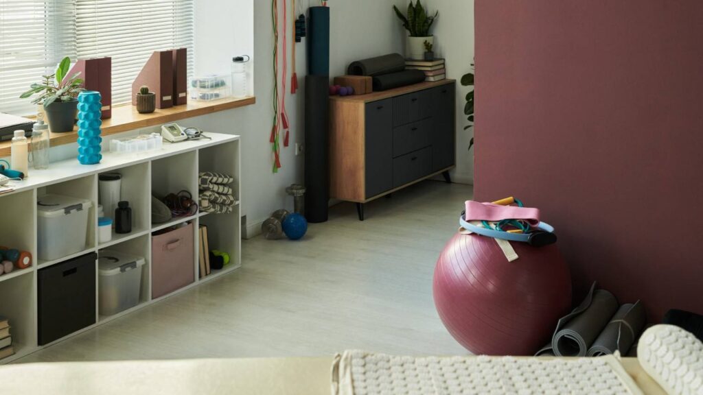 Compact home gym equipment arranged in a small space for full body workouts.